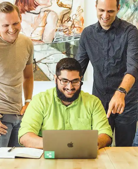 Smiling business professionals giving high five in office after successful meeting, teamwork and career growth concept
